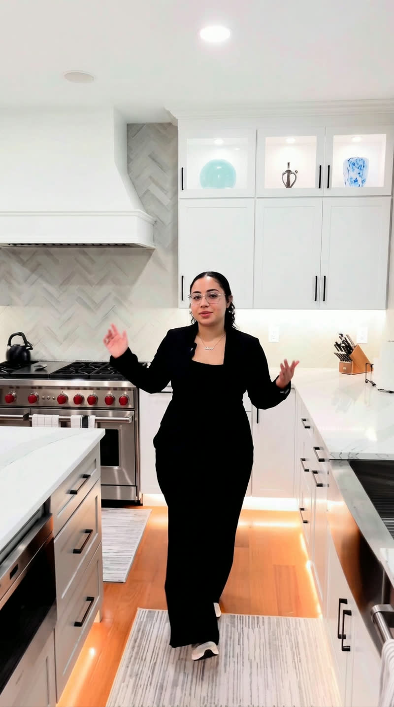 Owner of Virginia Pro Remodel presenting a finished kitchen remodel